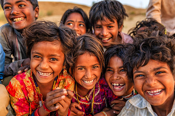 Group of happy Gypsy Indian children - desert village, Thar Desert, Rajasthan, India.